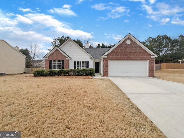 ranch-style home with a front lawn and a garage