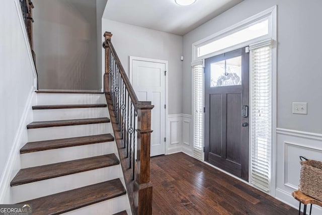 entrance foyer with dark hardwood / wood-style floors