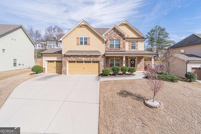 craftsman-style home featuring covered porch and a garage