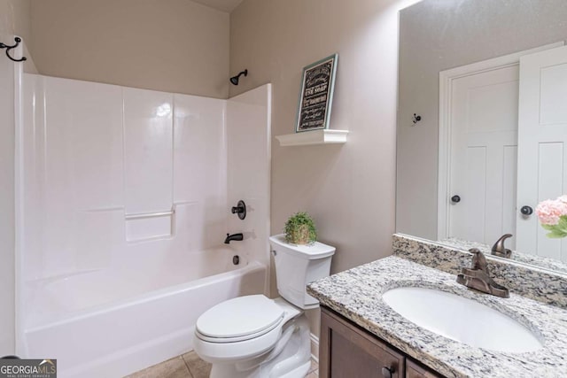 full bathroom featuring toilet, vanity, tile patterned flooring, and shower / bathing tub combination