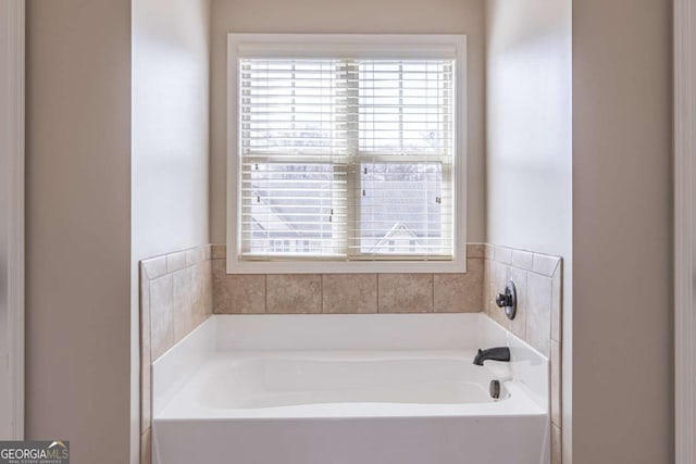 bathroom featuring a tub to relax in