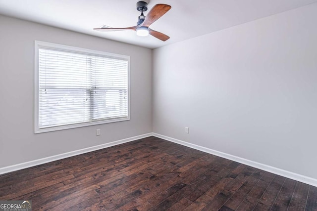 empty room featuring ceiling fan and dark wood-type flooring