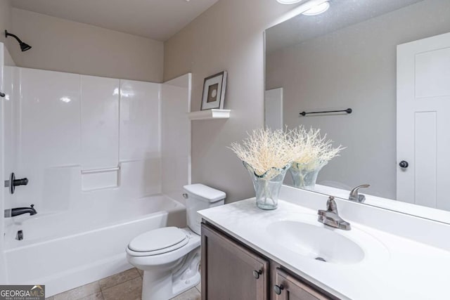 full bathroom with bathtub / shower combination, vanity, and toilet