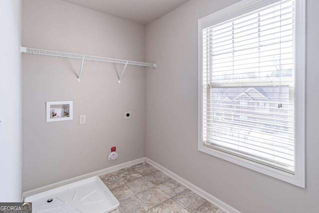 laundry room featuring hookup for an electric dryer, washer hookup, and a wealth of natural light