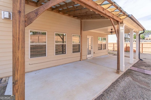 view of patio / terrace featuring ceiling fan and a pergola