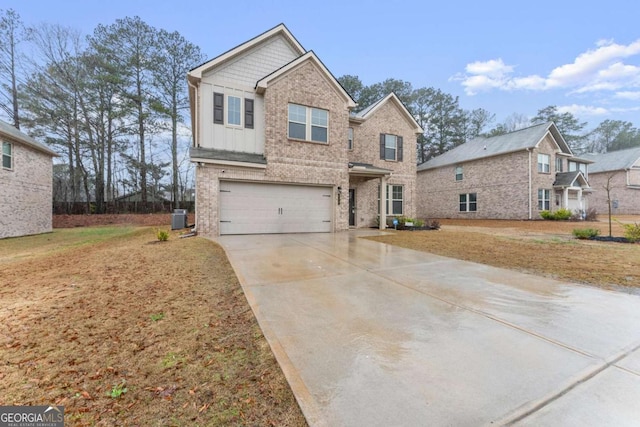 view of front of house with central AC and a garage