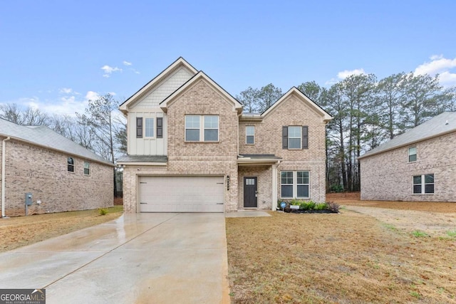 view of front of property featuring a front yard and a garage