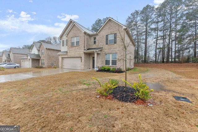 view of front of property with a garage and a front lawn