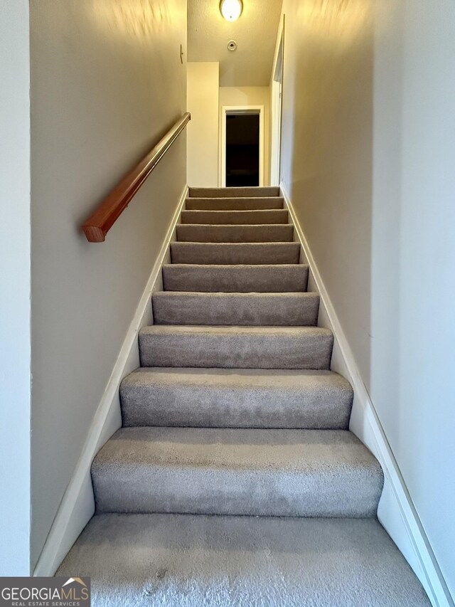 6900 Roswell Rd Unit 7N, Atlanta, GA 30328 - stairway with baseboards