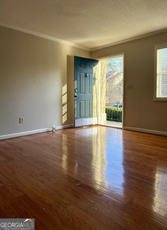 6900 Roswell Rd Unit 7N, Atlanta, GA 30328 - interior space with a textured ceiling, baseboards, dark wood-type flooring, and crown molding