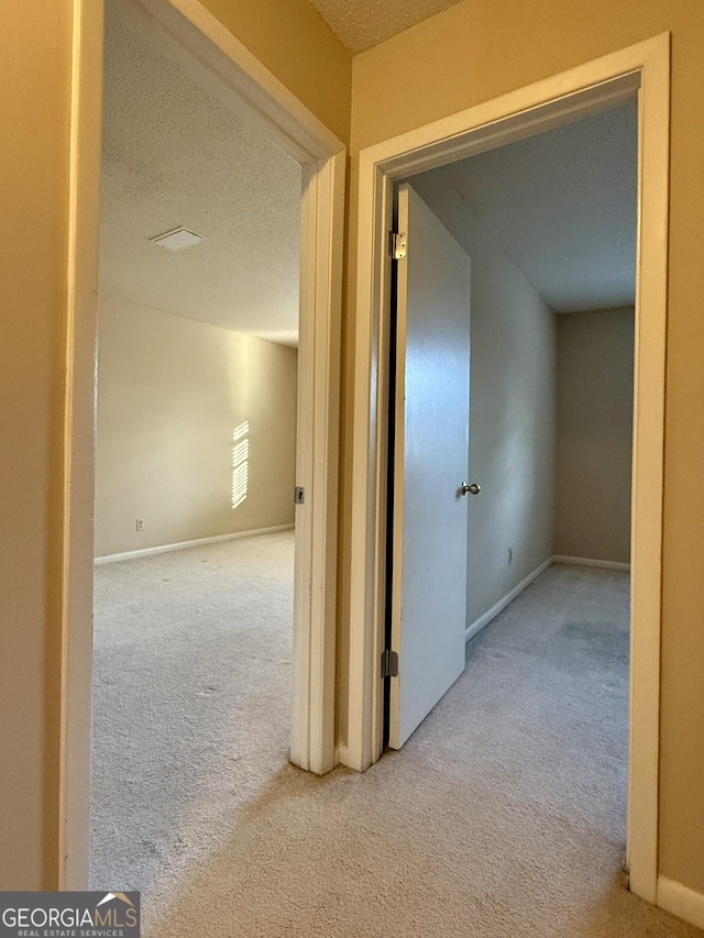 6900 Roswell Rd Unit 7N, Atlanta, GA 30328 - hall featuring carpet floors, baseboards, and a textured ceiling