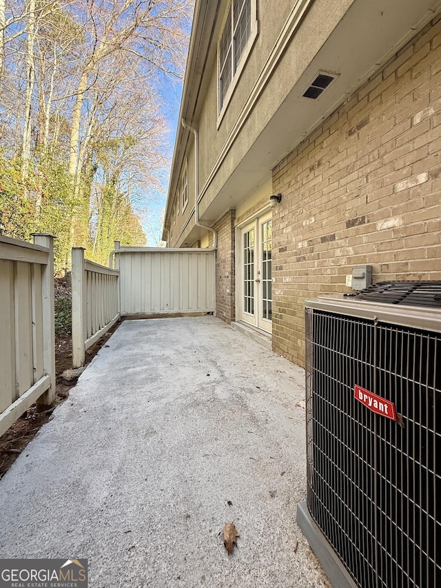 6900 Roswell Rd Unit 7N, Atlanta, GA 30328 - view of patio / terrace with french doors, fence, and central air condition unit
