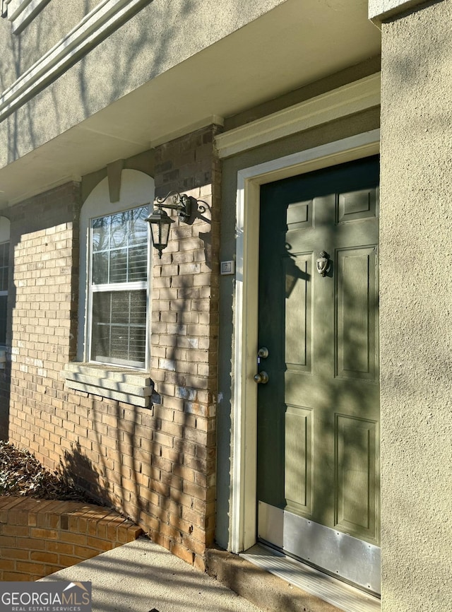 6900 Roswell Rd Unit 7N, Atlanta, GA 30328 - property entrance with brick siding and stucco siding