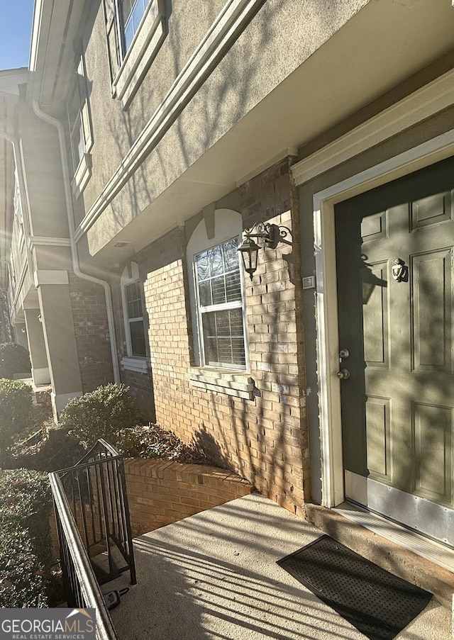 6900 Roswell Rd Unit 7N, Atlanta, GA 30328 - doorway to property featuring brick siding