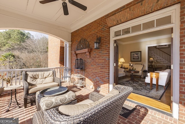 view of patio featuring ceiling fan and an outdoor living space