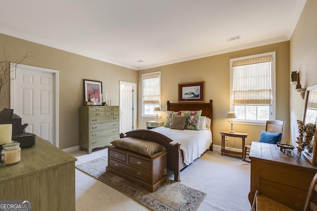 bedroom featuring baseboards, visible vents, crown molding, and light colored carpet