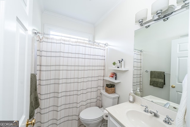 bathroom featuring toilet, ornamental molding, a shower with shower curtain, and vanity