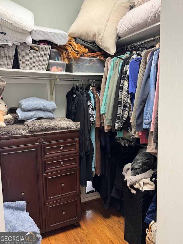 spacious closet with light wood-style flooring