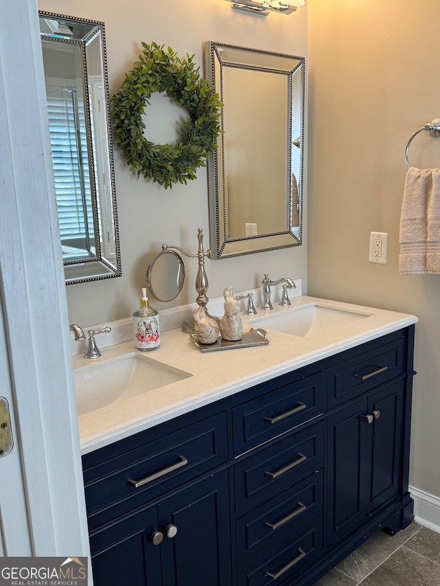 bathroom with a sink and double vanity