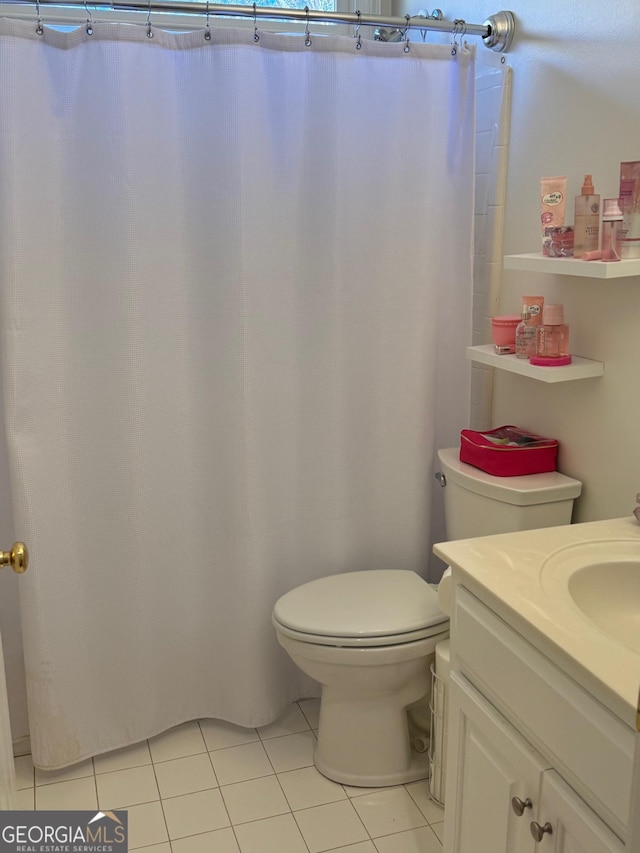 full bathroom featuring vanity, toilet, and tile patterned floors