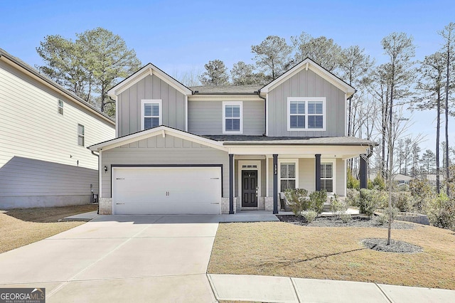 view of front facade with a garage and covered porch