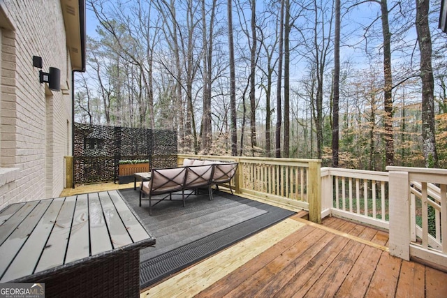 wooden terrace with outdoor lounge area