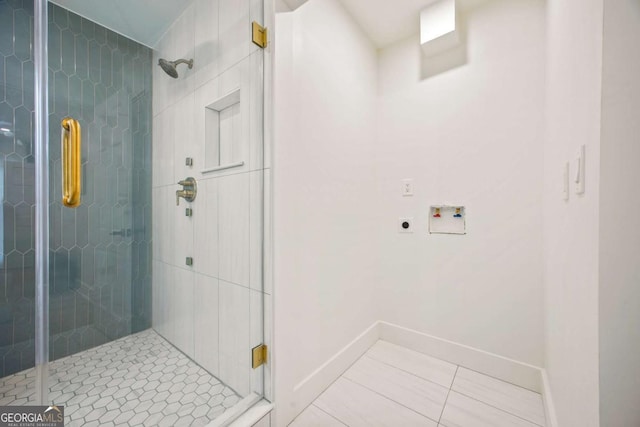 bathroom featuring tile patterned flooring and an enclosed shower