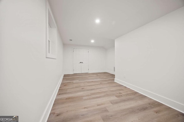 unfurnished room with light wood-type flooring