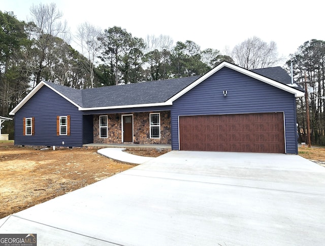 single story home featuring a garage