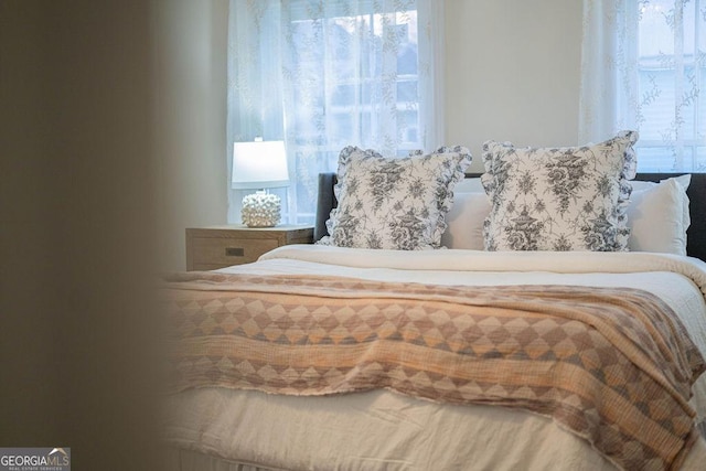 bedroom featuring multiple windows