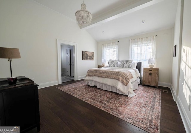 bedroom featuring vaulted ceiling and dark hardwood / wood-style flooring