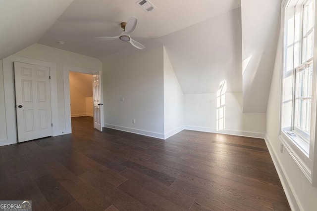 bonus room featuring ceiling fan, lofted ceiling, and dark hardwood / wood-style flooring