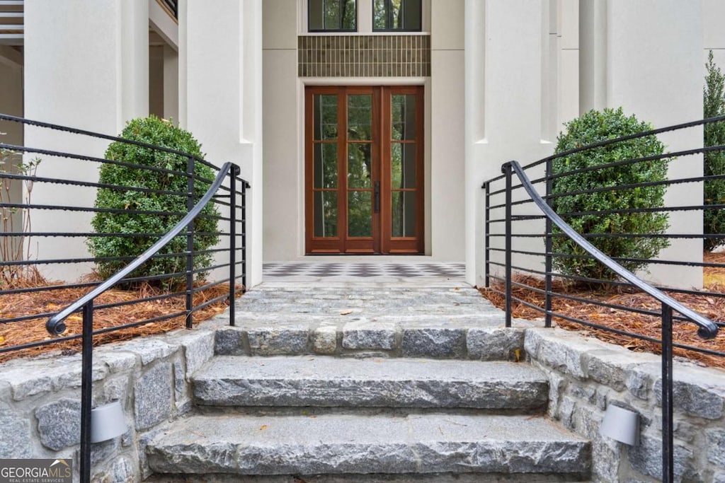 view of exterior entry featuring french doors