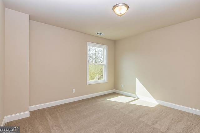 spare room with carpet flooring