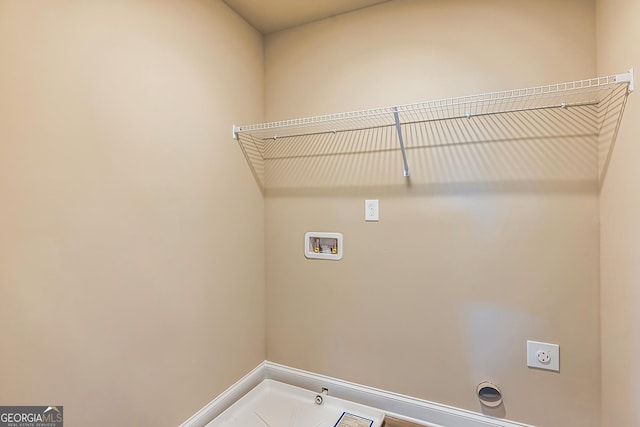 laundry area with hookup for a washing machine and electric dryer hookup