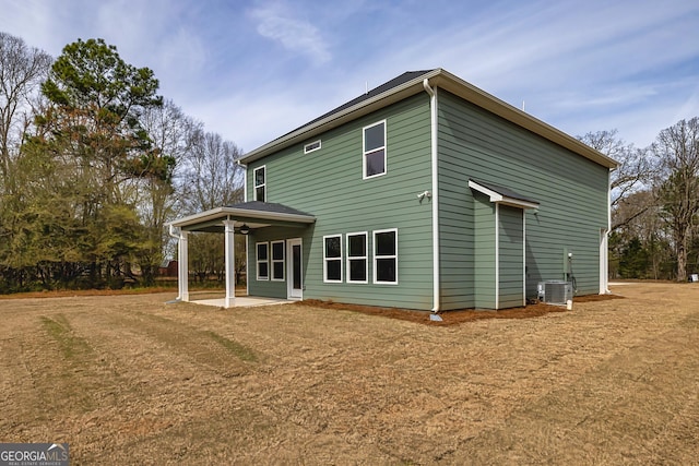 back of property featuring a patio area, central AC unit, and a lawn