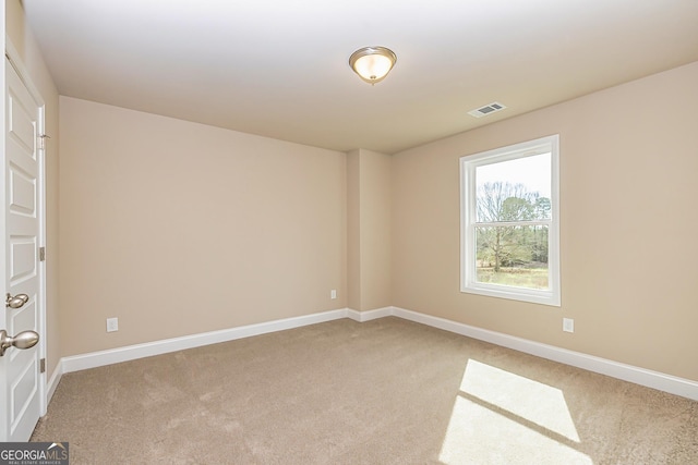 empty room with light colored carpet