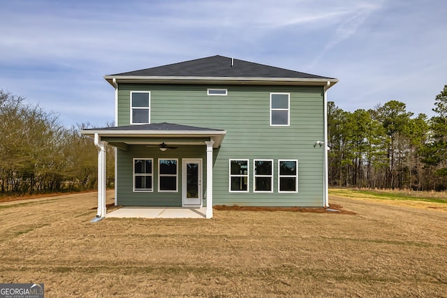 back of house with a yard, ceiling fan, and a patio area