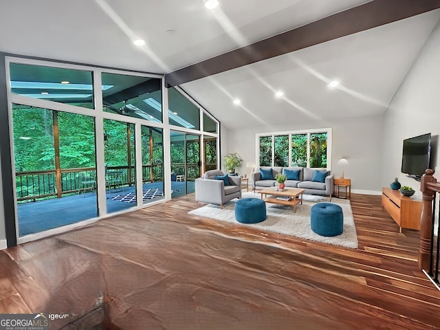 sunroom with vaulted ceiling with beams