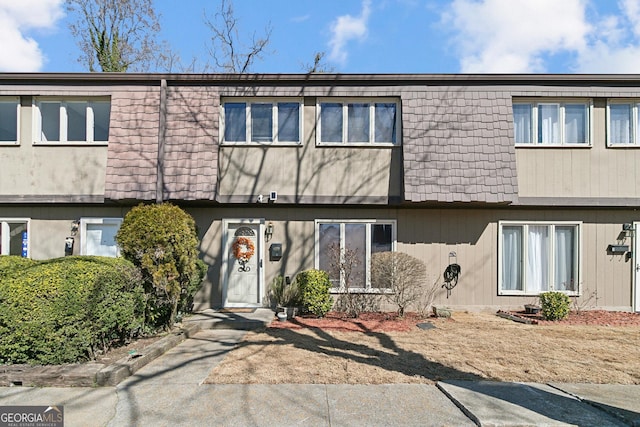 multi unit property featuring mansard roof