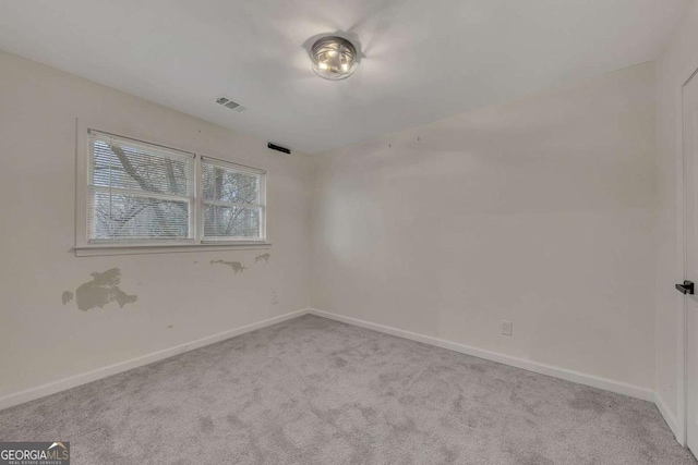 empty room featuring light colored carpet