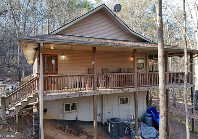 rear view of house featuring cooling unit