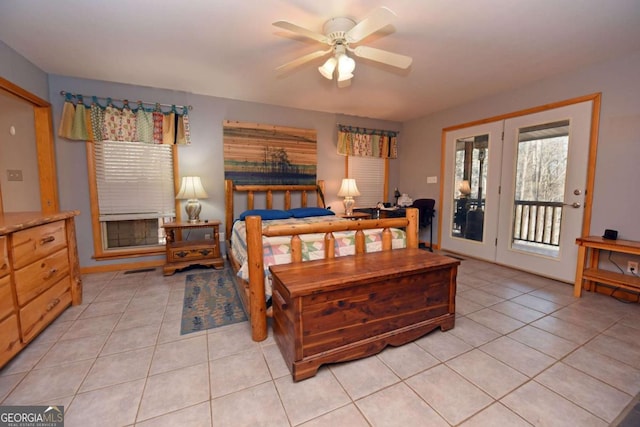 bedroom featuring light tile patterned floors, ceiling fan, and access to outside