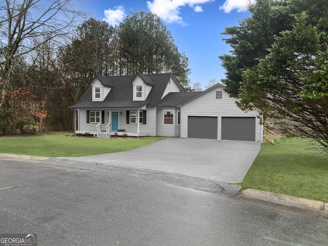 new england style home with concrete driveway, a front yard, and a garage