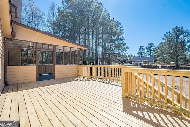 deck with a sunroom