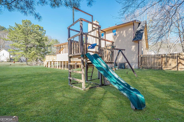 view of jungle gym with central air condition unit, a lawn, and fence