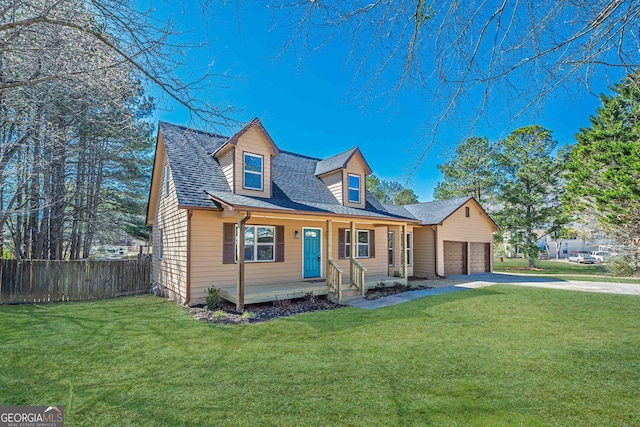 cape cod house featuring an attached garage, a shingled roof, a front yard, and fence