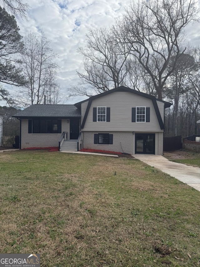 split level home with a front yard