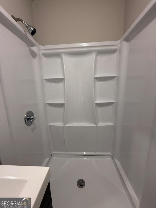 bathroom featuring walk in shower