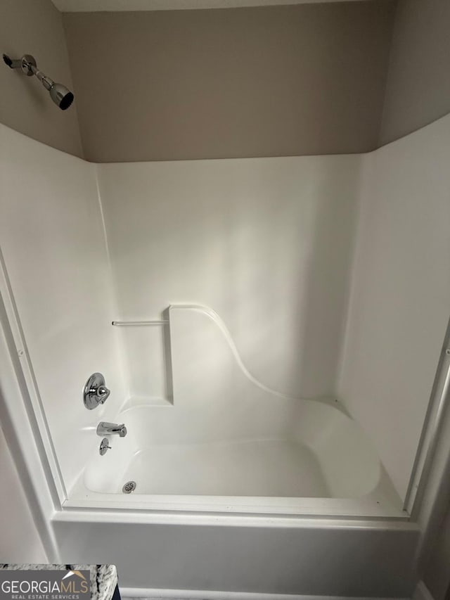 bathroom with shower / bath combination